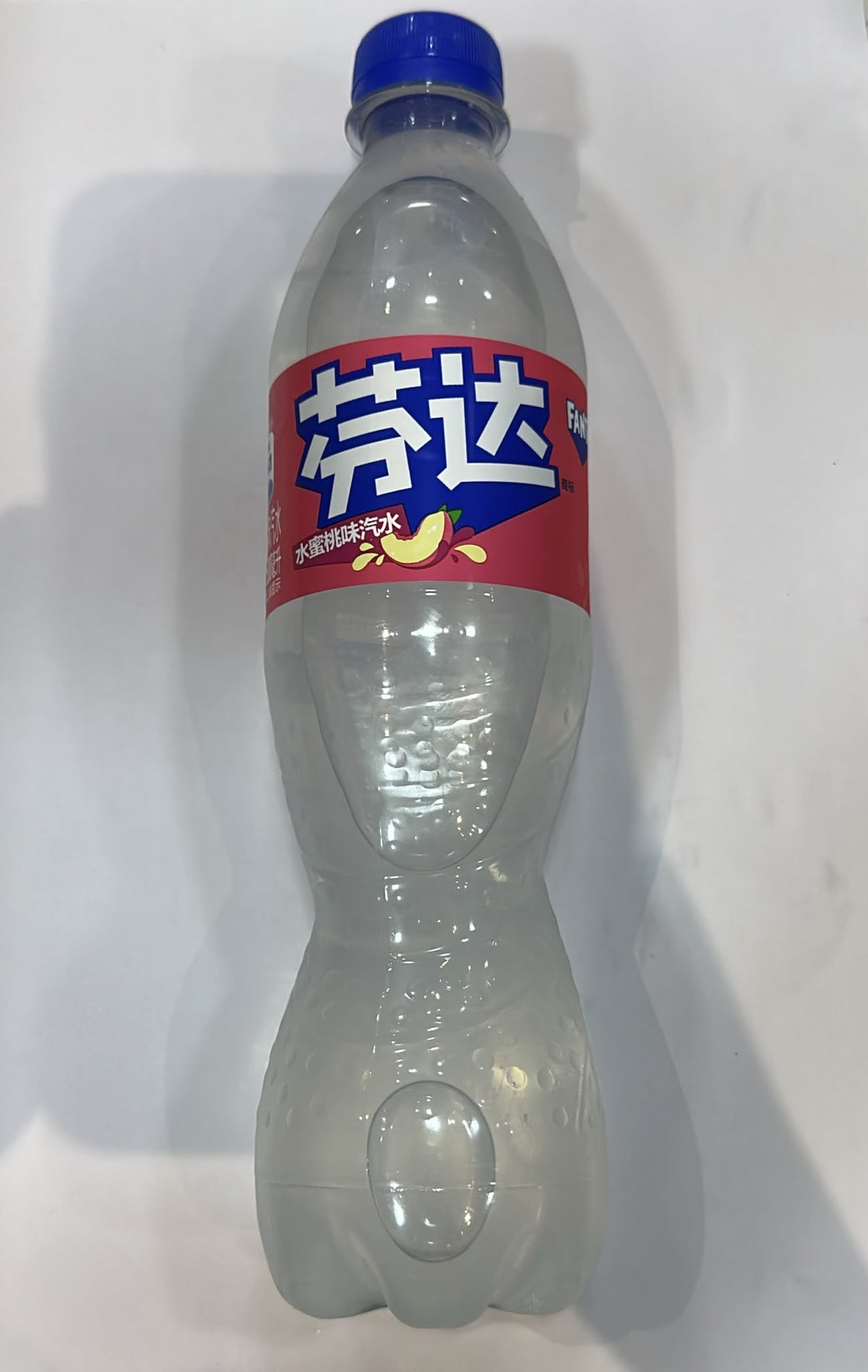 Fanta White Peach Carbonated Drink front of bottle | Asian Grocery UK
