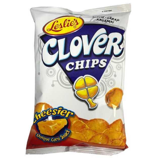 Crunchy Leslies Clover Chips Cheesier in an 85g pack, showcasing golden, clover-shaped corn snacks with a cheesy glow.