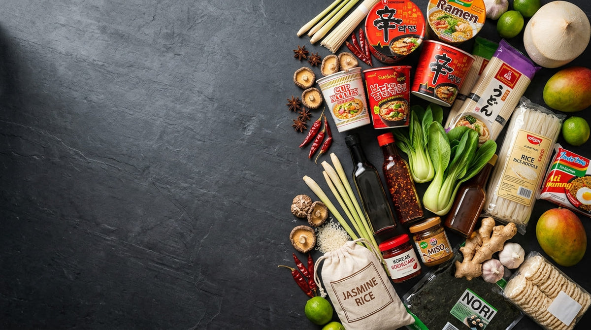 Selection of Asian groceries including noodles, sauces, spices and fresh vegetables